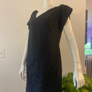 Little black dress. Lots of details. Causal dressy